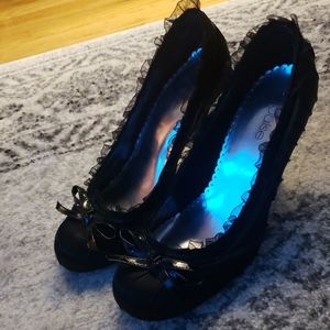 Delicate black ruffle stilettos